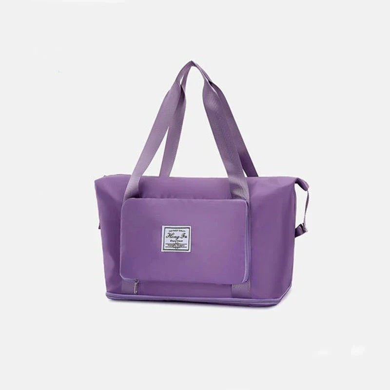 Expandable travel duffel bag with adjustable shoulder strap, multiple interior pockets, and water-resistant Oxford cloth material