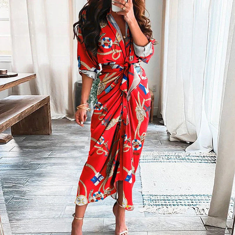 A beautiful floral wrap dress with lace-up detailing, featuring a deep V-neck and full-length skirt for a flattering, elegant look.