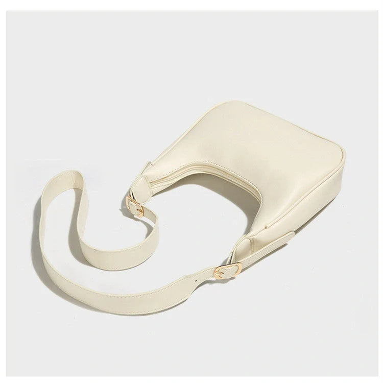 Stylish women's PU leather dumpling crossbody bag in black and white