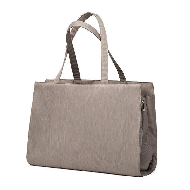 A premium quality mother and baby bag made from soft, durable Oxford cloth with a large 20-35L capacity, versatile backpack or shoulder bag design, and customisable interior pockets.