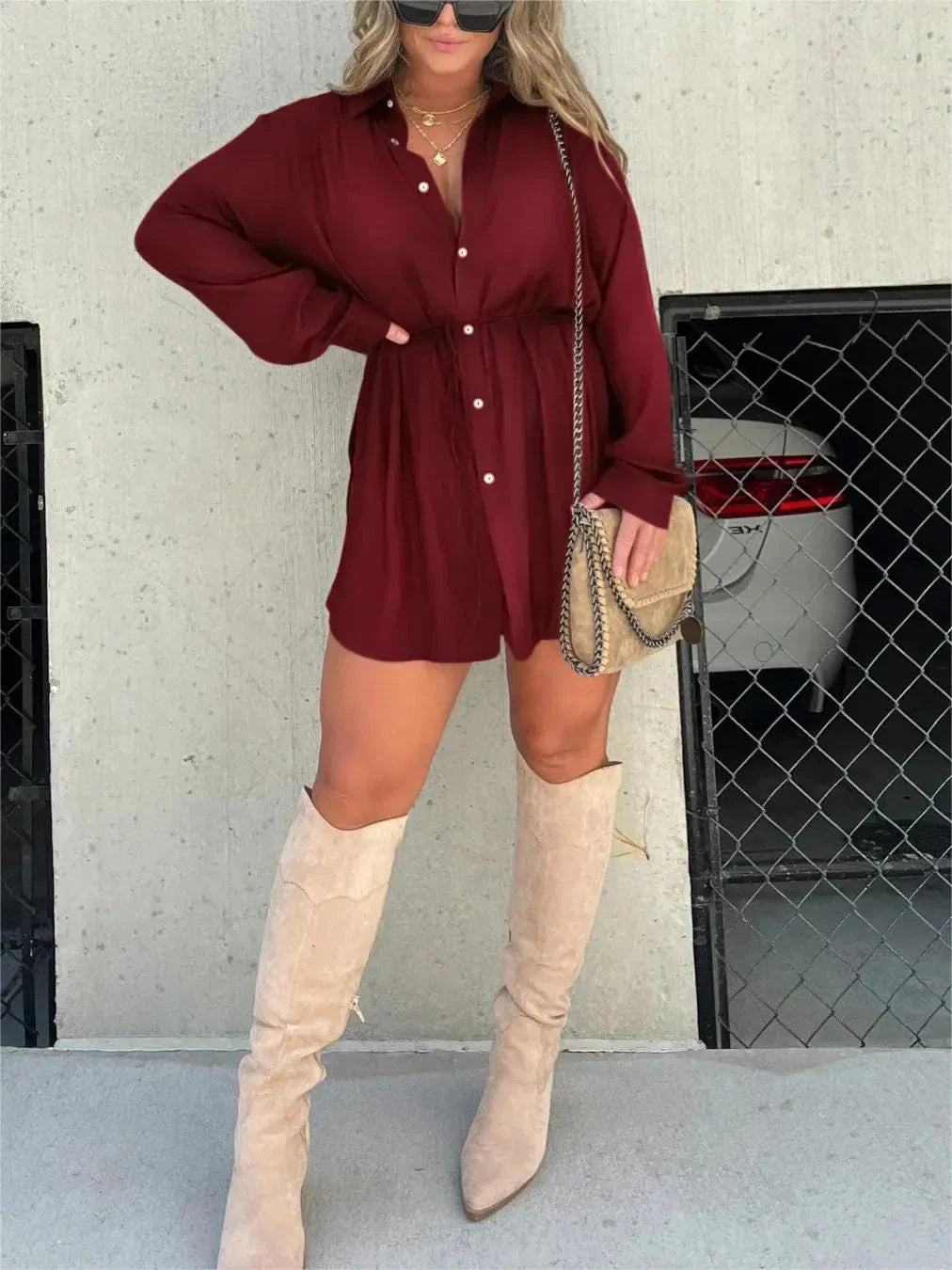 Women's long sleeve jumpsuit with button accents in various vibrant colors