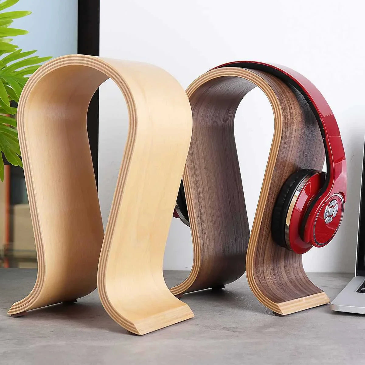 Elegant solid wood headphone stand in a contemporary design for beautiful display of audio equipment