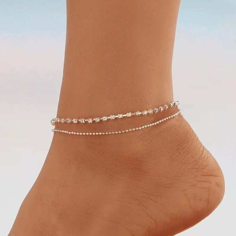 Stylish multi-layer beaded anklet necklace set with a geometric design in gold and silver tones