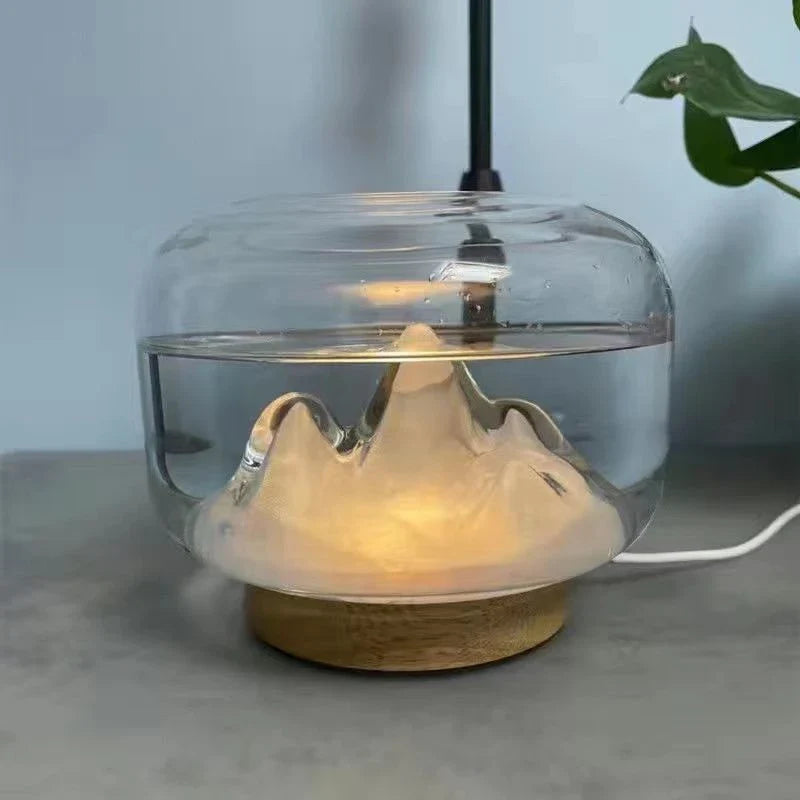 Premium aroma diffuser with serene mountain landscape design and multi-coloured night light for relaxation and well-being