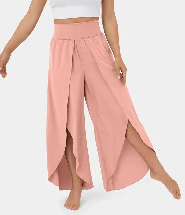 Versatile high-waist split-leg yoga trousers in a variety of colours, featuring a wide-leg silhouette and elasticated waistband for comfort and style.