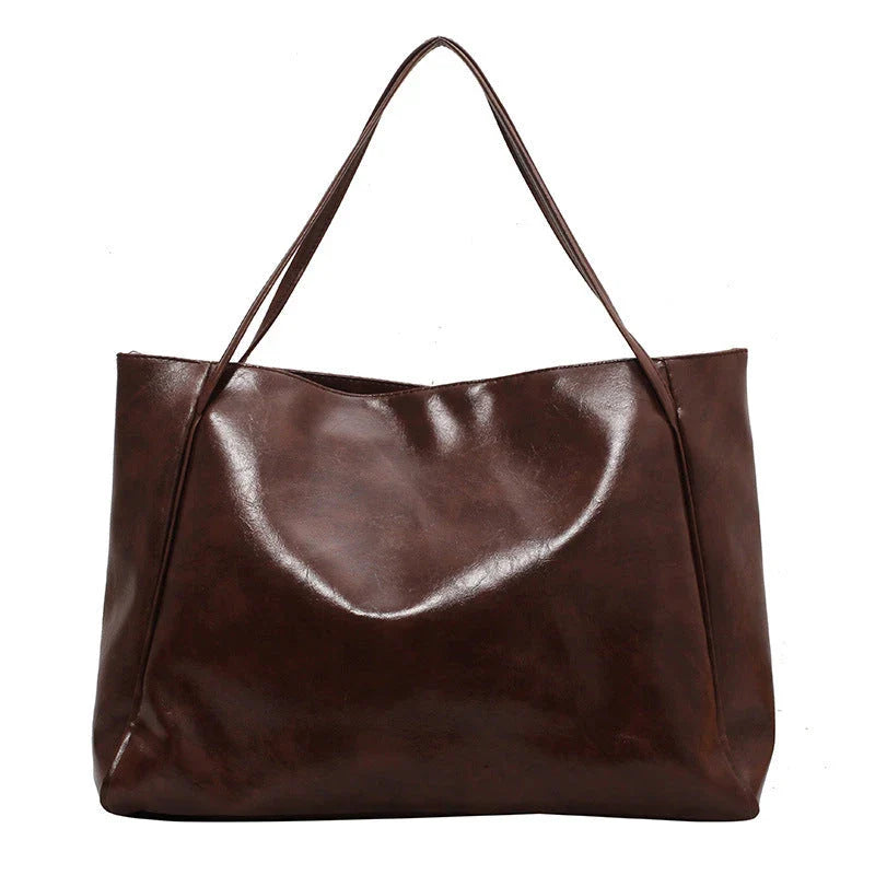 Premium faux leather shoulder bag in various colors, featuring a classic silhouette and roomy interior for everyday convenience.