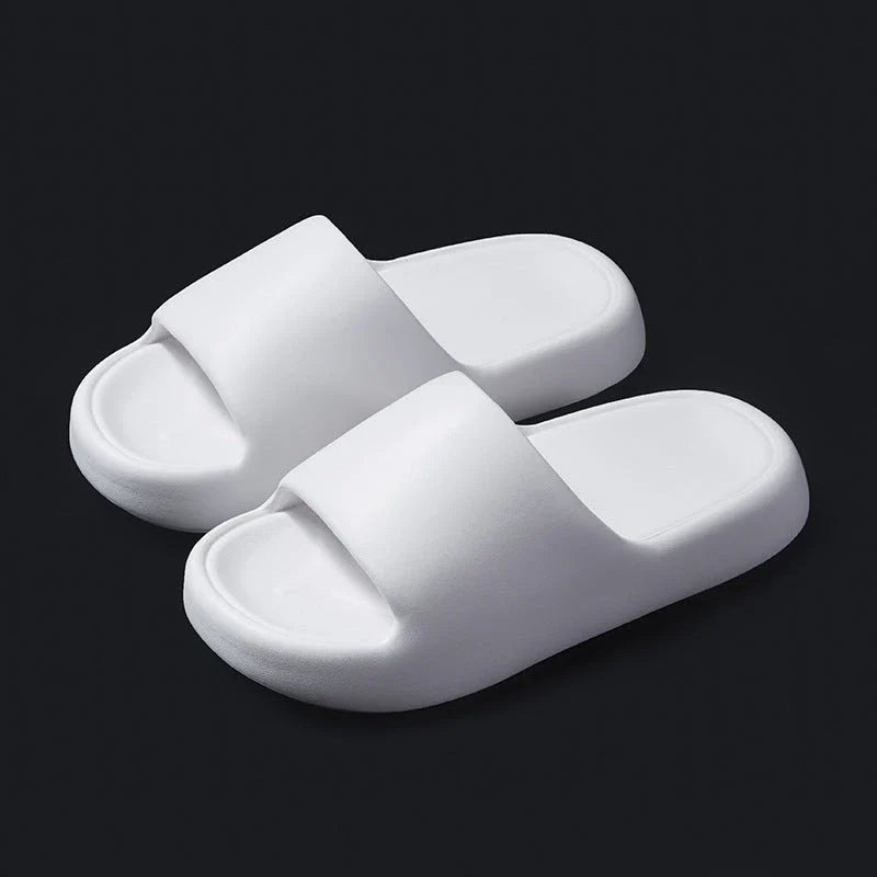 Comfortable EVA foam slip-on slippers in various colors, featuring non-slip soles and a breathable design for indoor and bathroom use.