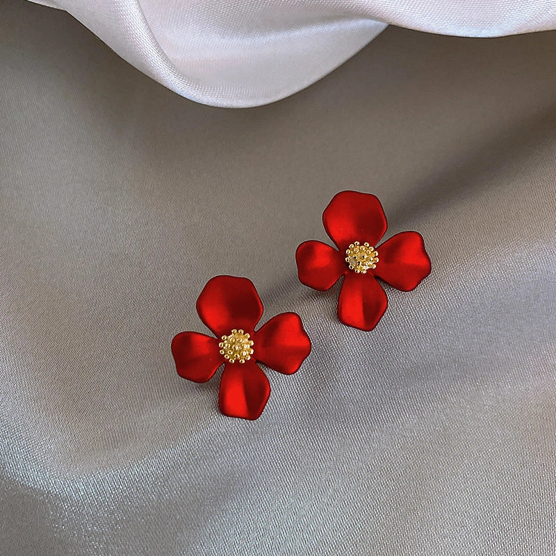 Elegant silver earrings with delicate red petal design inspired by Korean fashion