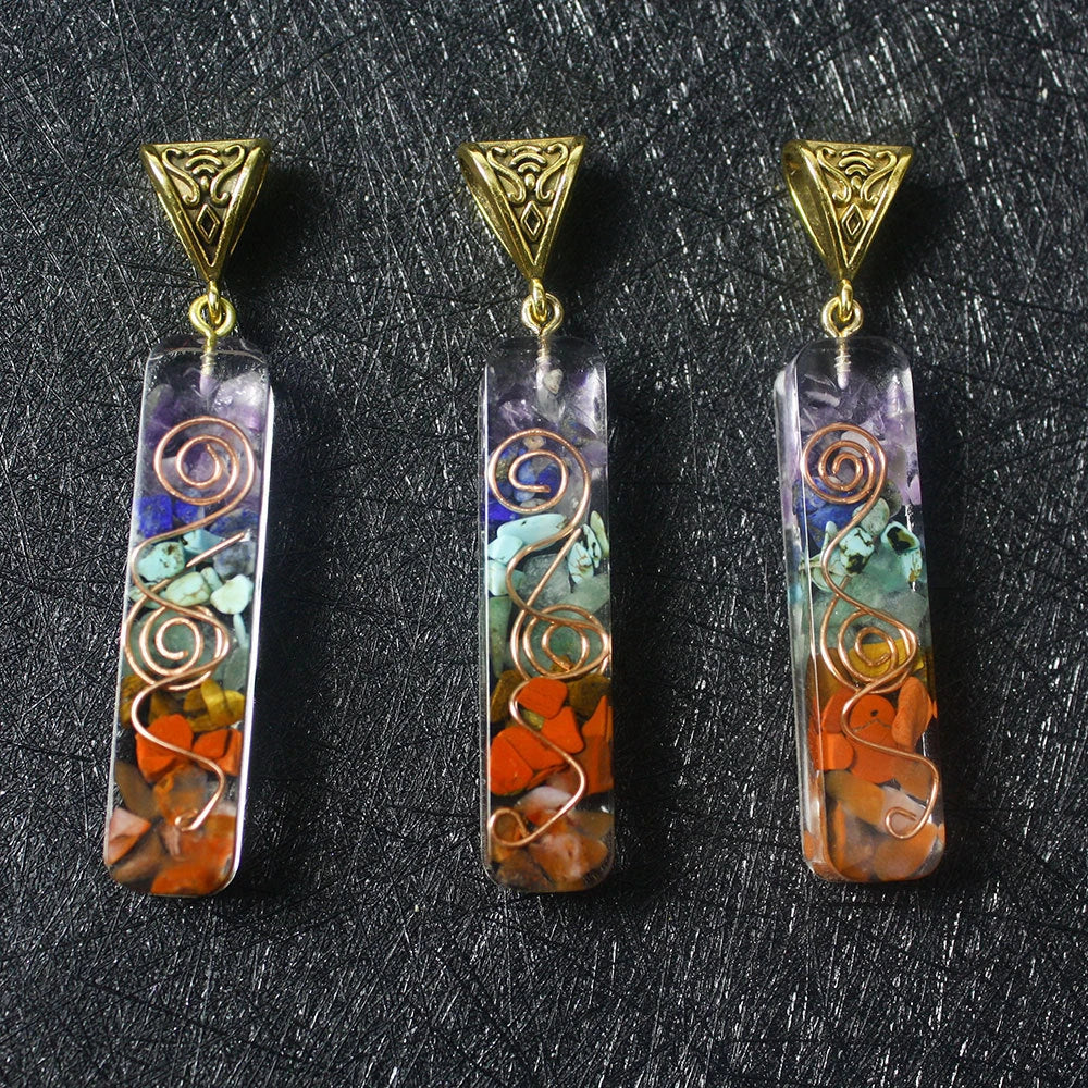 A stunning chakra crystal pendant with natural patterns and organic imperfections, showcasing the beauty of nature.