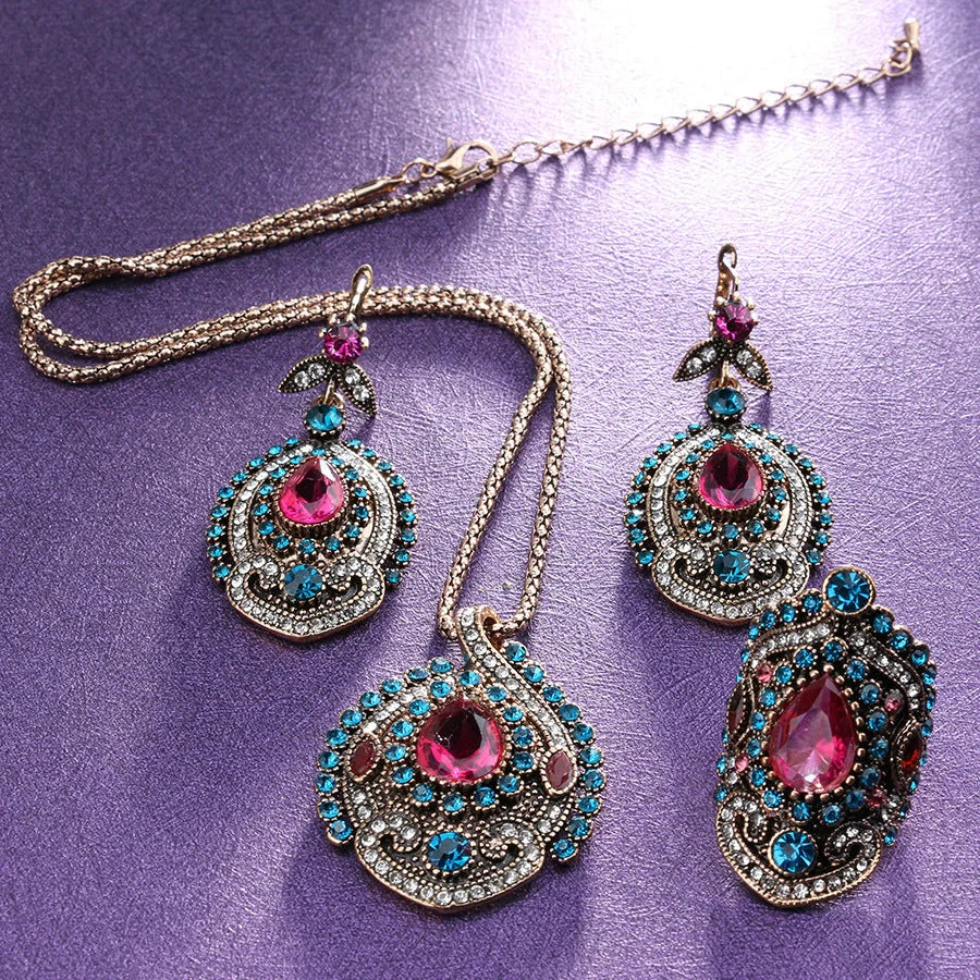 Elegant bohemian-style jewellery set featuring necklaces, earrings, and rings in a variety of colours and sizes