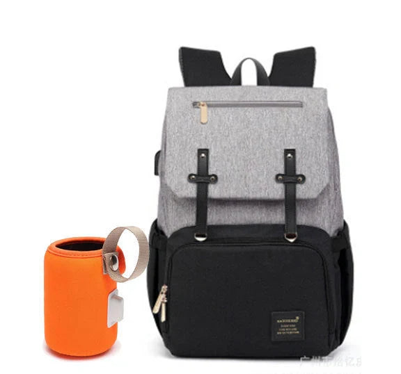 Versatile mummy bag with stroller hooks, side pockets, and zippered compartments for storing baby essentials