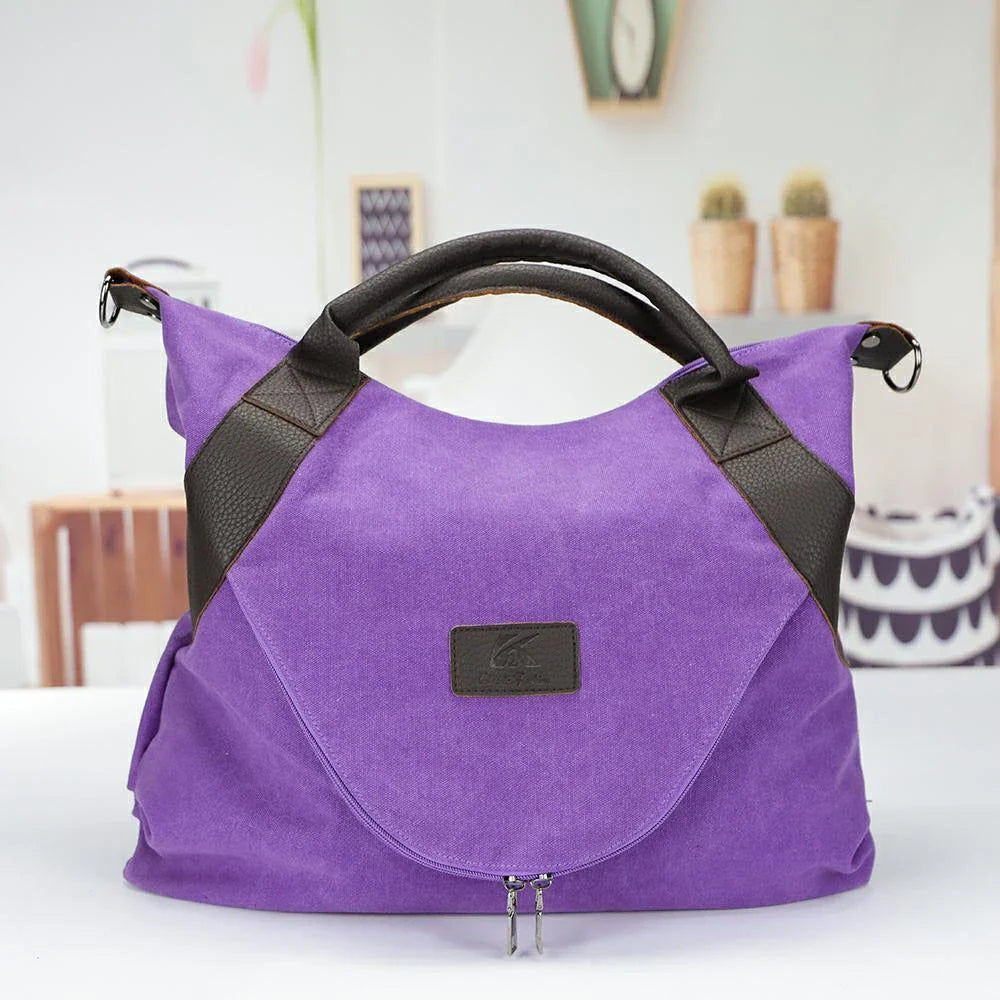 Stylish and versatile canvas shoulder bag with premium brass hardware and thoughtful interior organisation