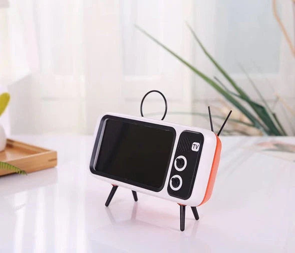 Vintage-inspired portable Bluetooth speaker with retro TV-style design and sleek, compact body