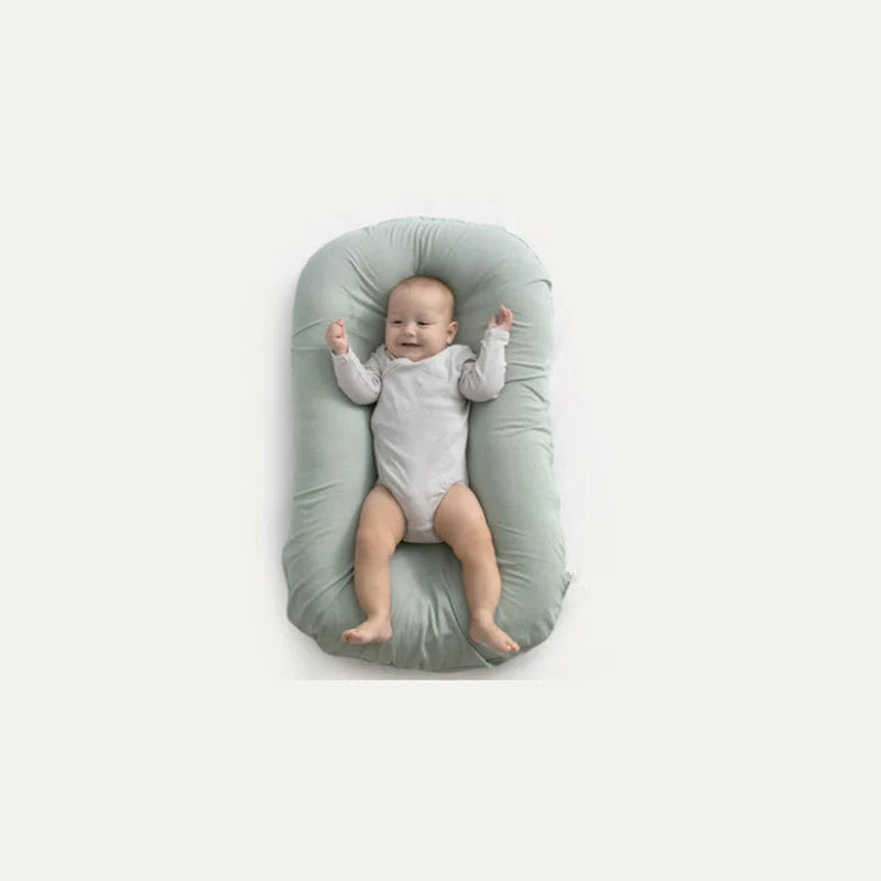Portable baby nest crib with cotton cover for newborns, dimensions 75cm by 45cm