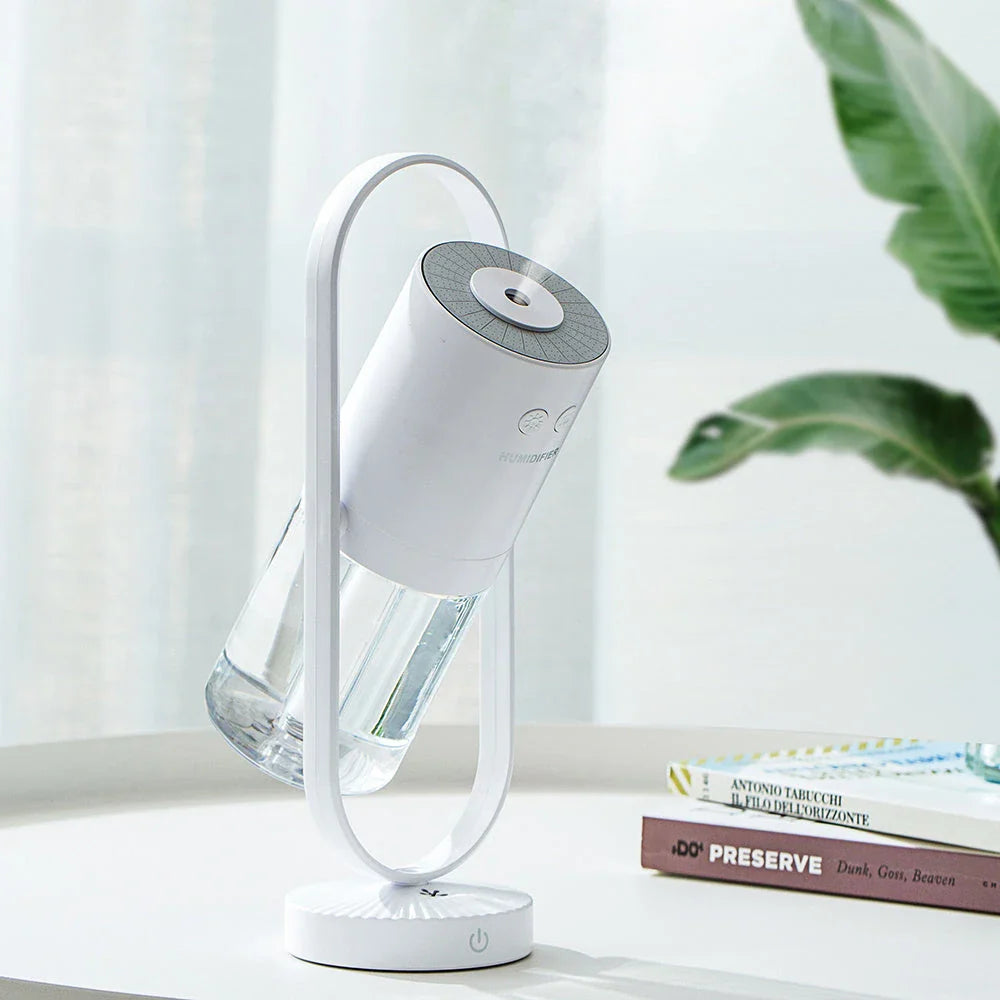 Compact USB Powered Desktop Humidifier with Ambient Lighting, featuring adjustable mist nozzle and romantic starry projection