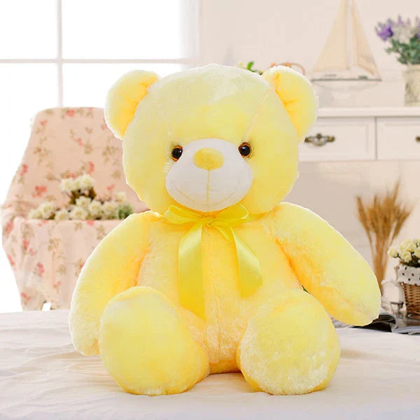 A soft and cuddly teddy bear plush toy with captivating color-changing LED lights, perfect for bringing wonder and delight to a child's room.