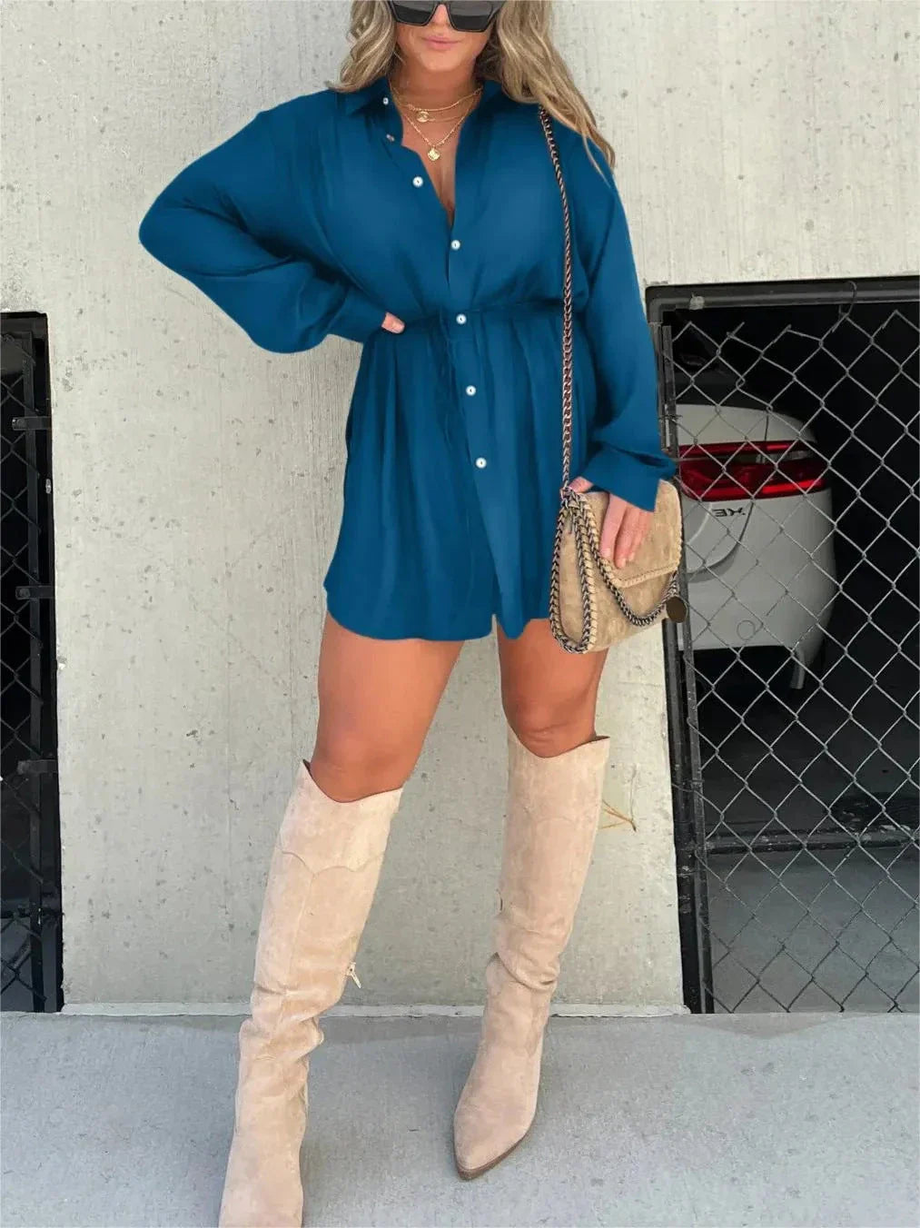 Women's long sleeve jumpsuit with button accents in various vibrant colors