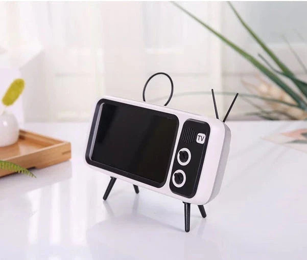 Vintage-inspired portable Bluetooth speaker with retro TV-style design and sleek, compact body