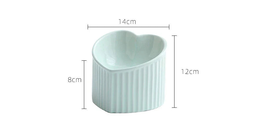Elevated ceramic pet bowl with angled design for comfortable, natural feeding of cats and dogs