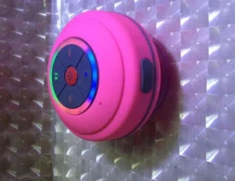 Compact waterproof Bluetooth speaker in various colours, with hands-free calling and premium audio performance