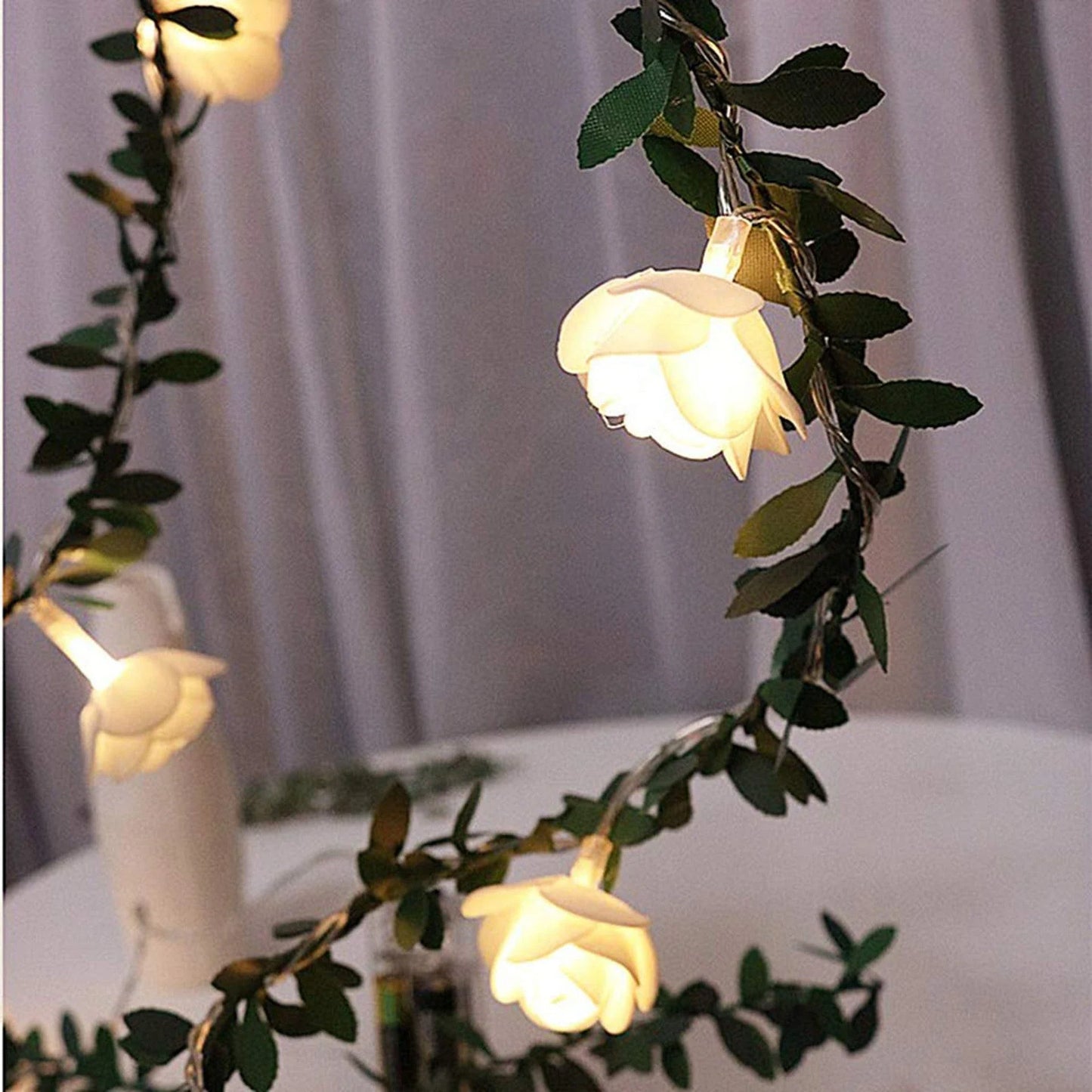Elegant rose vine fairy lights with warm white LED bulbs for cozy, romantic home decor