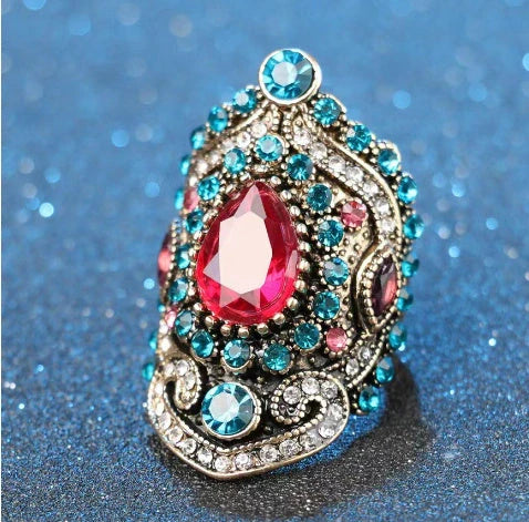 Elegant bohemian-style jewellery set featuring necklaces, earrings, and rings in a variety of colours and sizes