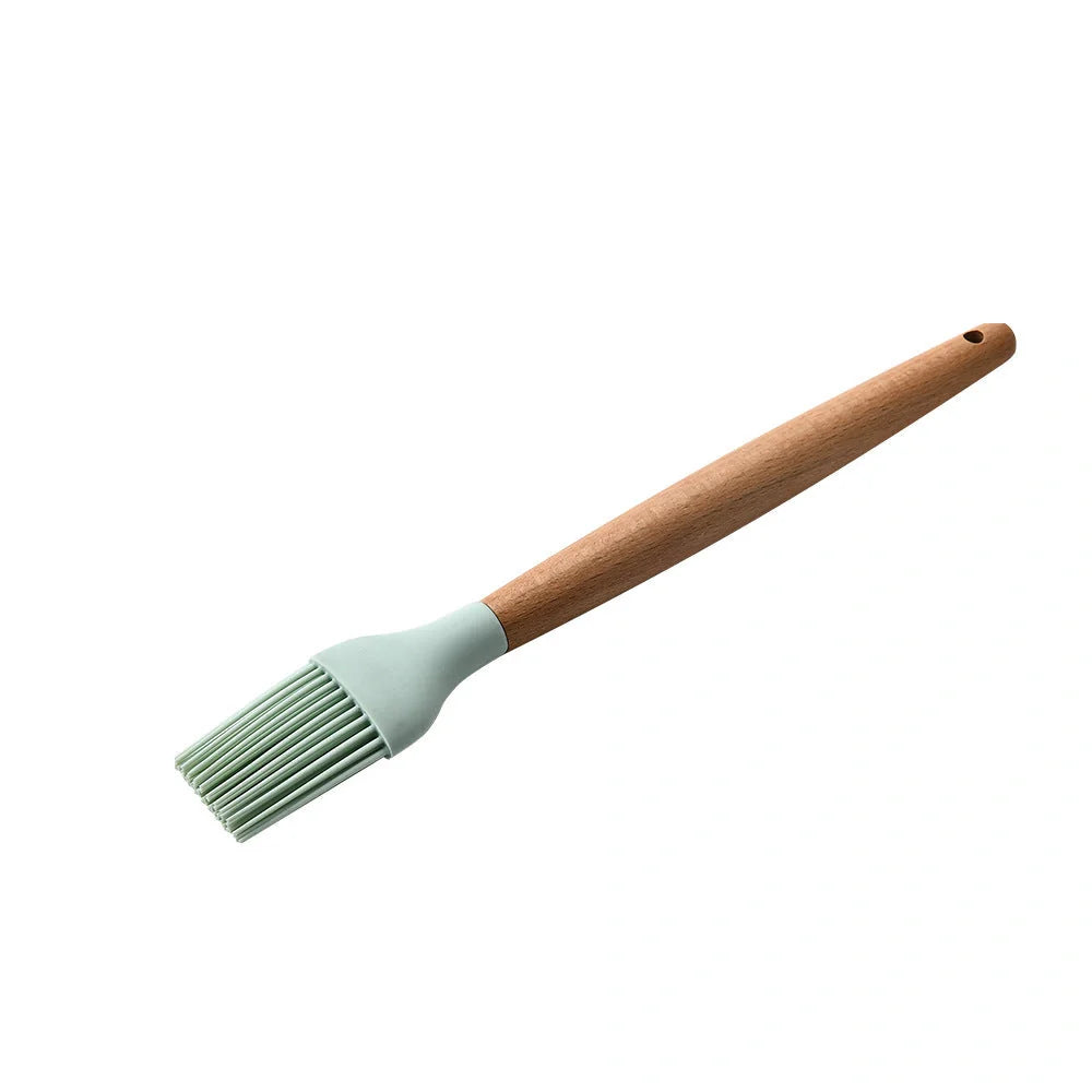 Silicone kitchenware set with wooden handles in various colors and styles, perfect for cooking, baking, and serving