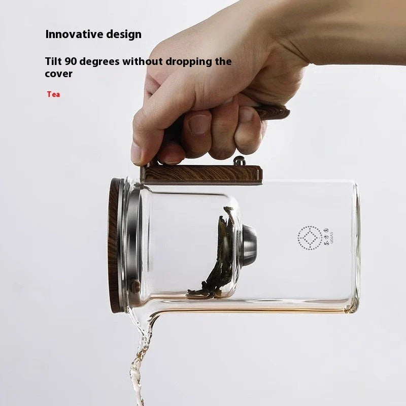 Smart one-button magnetic tea infuser pot with wooden handle, featuring heat-resistant borosilicate glass construction and seamless tea brewing experience.