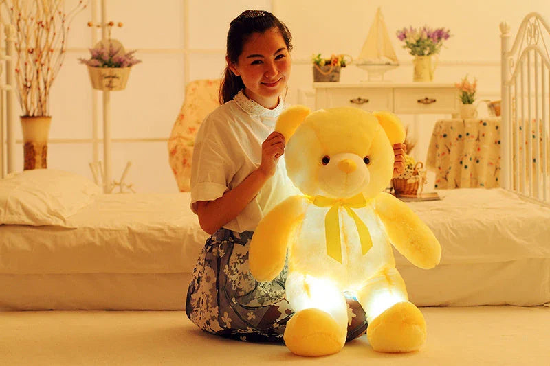 A soft and cuddly teddy bear plush toy with captivating color-changing LED lights, perfect for bringing wonder and delight to a child's room.