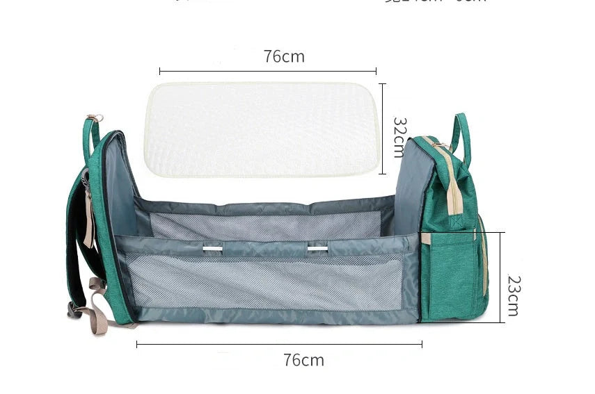 Portable folding crib and mummy bag in green and grey, compact design for baby travel