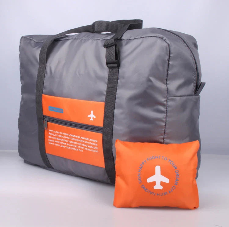 Foldable nylon travel holdall in various colours, including black, orange, green, and red