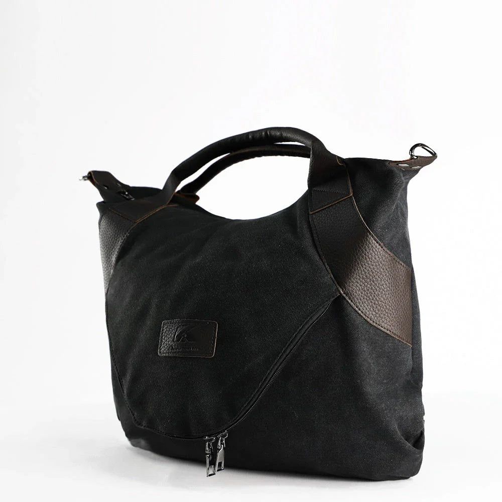 Stylish and versatile canvas shoulder bag with premium brass hardware and thoughtful interior organisation