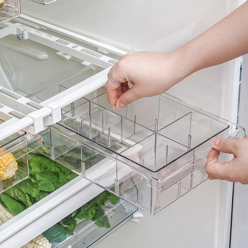 Transparent rectangular storage box with modular grid system for organised storage in kitchen or office