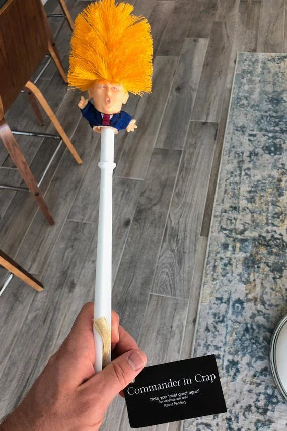 Hilarious Trump-themed toilet brush with bright yellow color and distinctive design