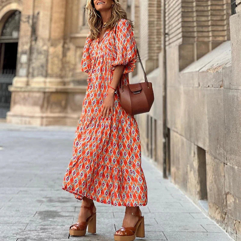 A bohemian-inspired floral midi dress in a variety of vibrant colors for the perfect summer look