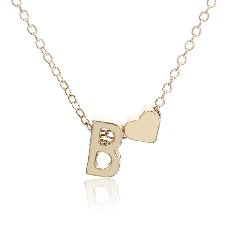 Heart-shaped pendant necklace with adjustable chain in various metallic finishes