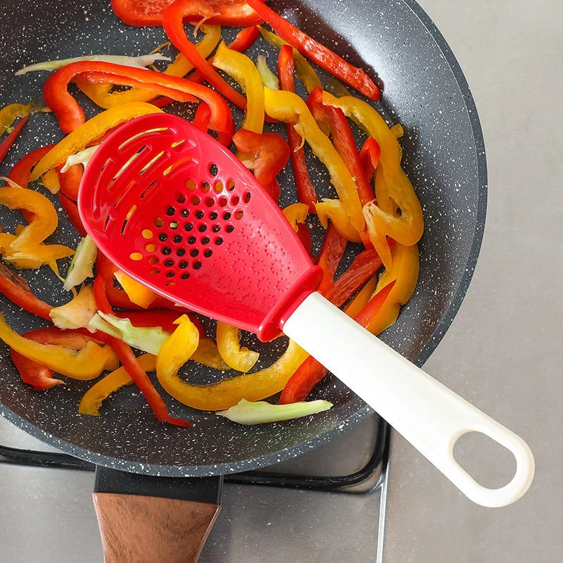 Versatile kitchen spoon for grinding, pressing, and stir-frying in red and black