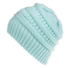 Stylish knitted wool beanie for British ladies with a discreet ponytail hole and a variety of vibrant colour options