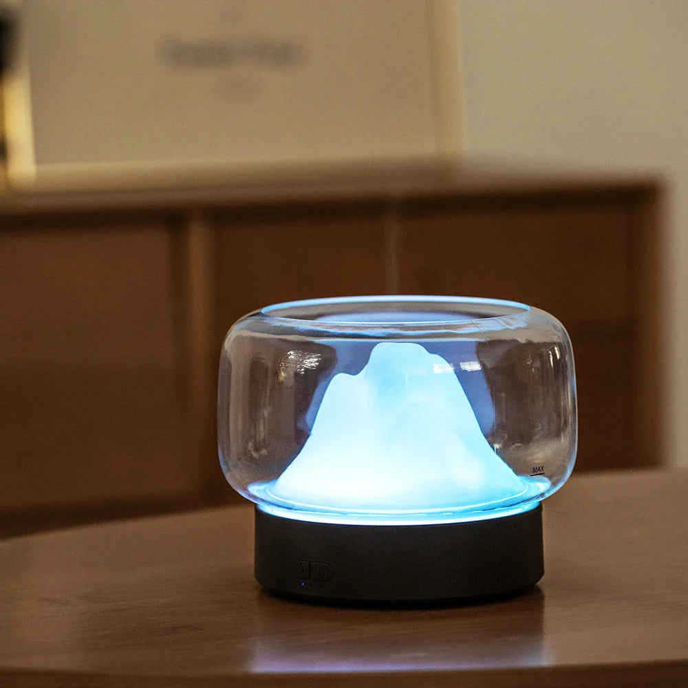 Premium aroma diffuser with serene mountain landscape design and multi-coloured night light for relaxation and well-being