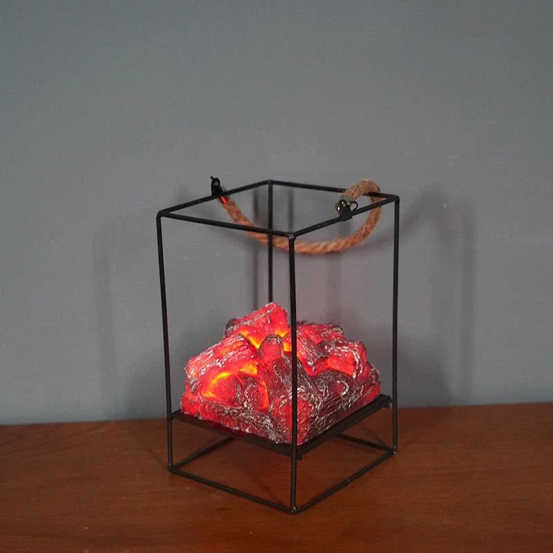 A charcoal-coloured fireplace lamp with a mesmerising LED flame effect, creating a cosy and inviting atmosphere in a living room.