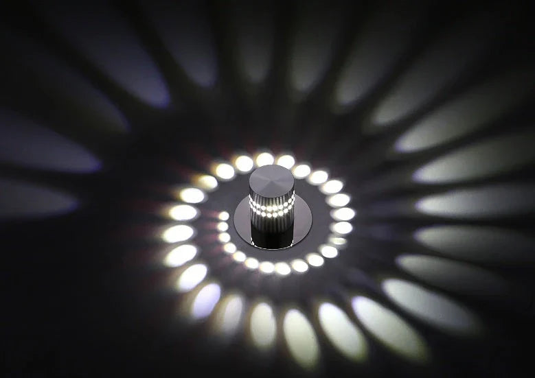 Colorful LED wall lights with a spiral design, featuring a wireless remote control for adjusting the vibrant color-changing display.