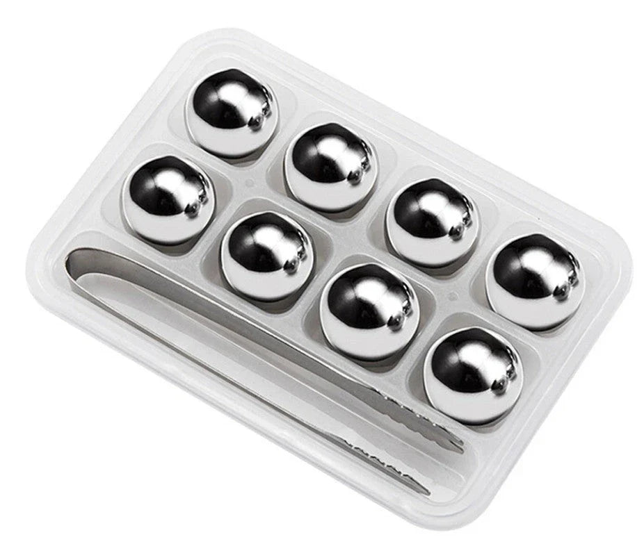 Premium stainless steel whisky chilling stones set in various shapes and sizes, including square, circular, heart, and diamond-shaped stones