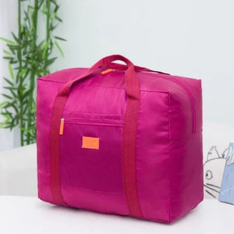 Foldable nylon travel holdall in various colours, including black, orange, green, and red