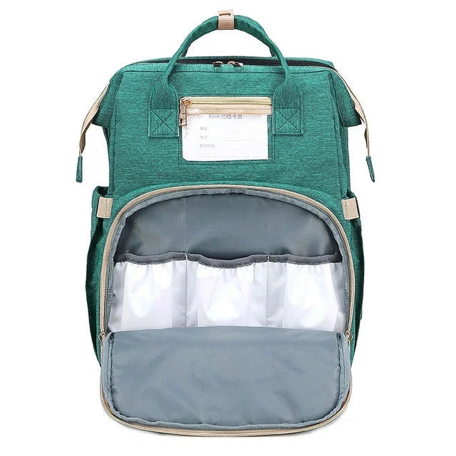 Portable folding crib and mummy bag in green and grey, compact design for baby travel