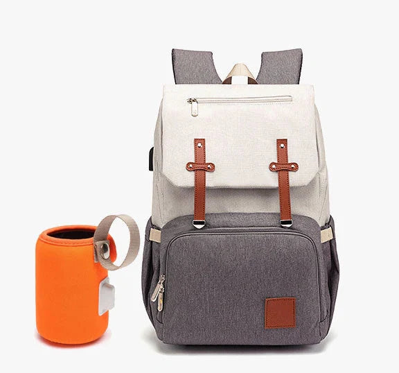 Versatile mummy bag with stroller hooks, side pockets, and zippered compartments for storing baby essentials