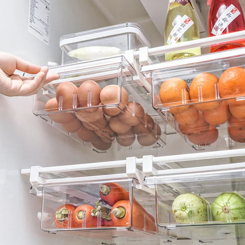 Transparent rectangular storage box with modular grid system for organised storage in kitchen or office