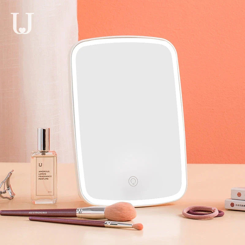 Adjustable LED makeup mirror with three-colour lighting, high-definition glass, and foldable design for versatile grooming on the go