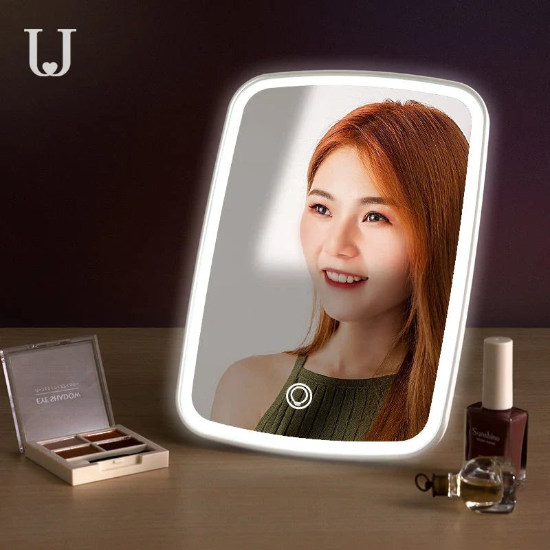 Adjustable LED makeup mirror with three-colour lighting, high-definition glass, and foldable design for versatile grooming on the go