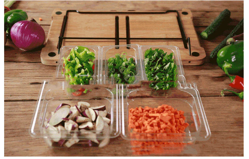 Bamboo cutting board with plastic storage trays for organizing and containing chopped food items