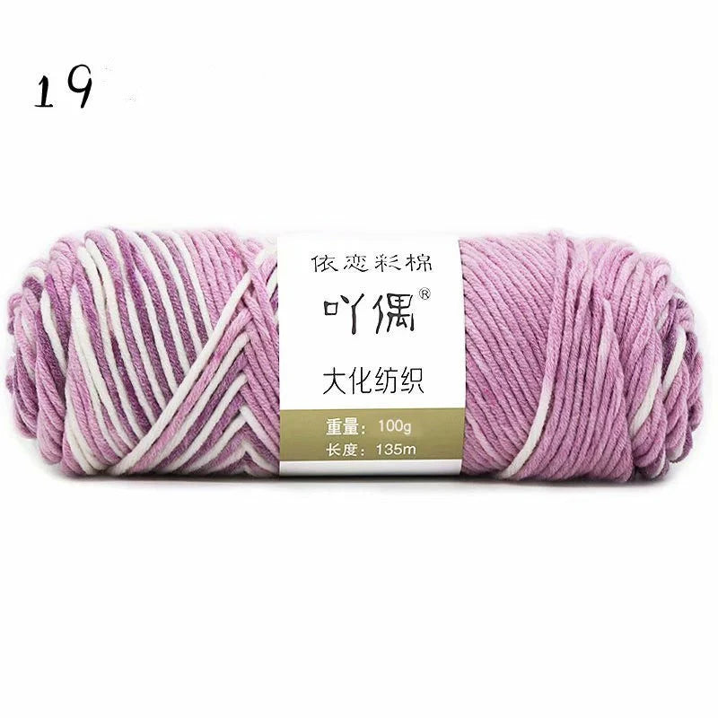 Luxurious gradient milk cotton yarn balls in a variety of vibrant colours, perfect for knitting, weaving, and other textile crafts.